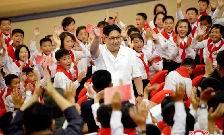 Kim Jong Un with KCU members in June 2016