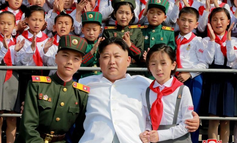 Kim Jong Un posing for a photo with KCU members in June 2016