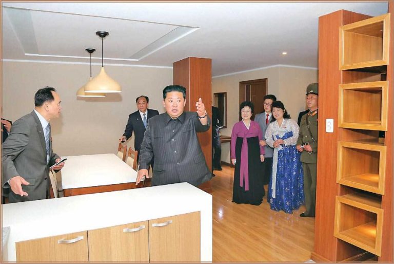 The respected Kim Jong Un looked round the dwelling houses in the Pothong Riverside Terraced Houses District.